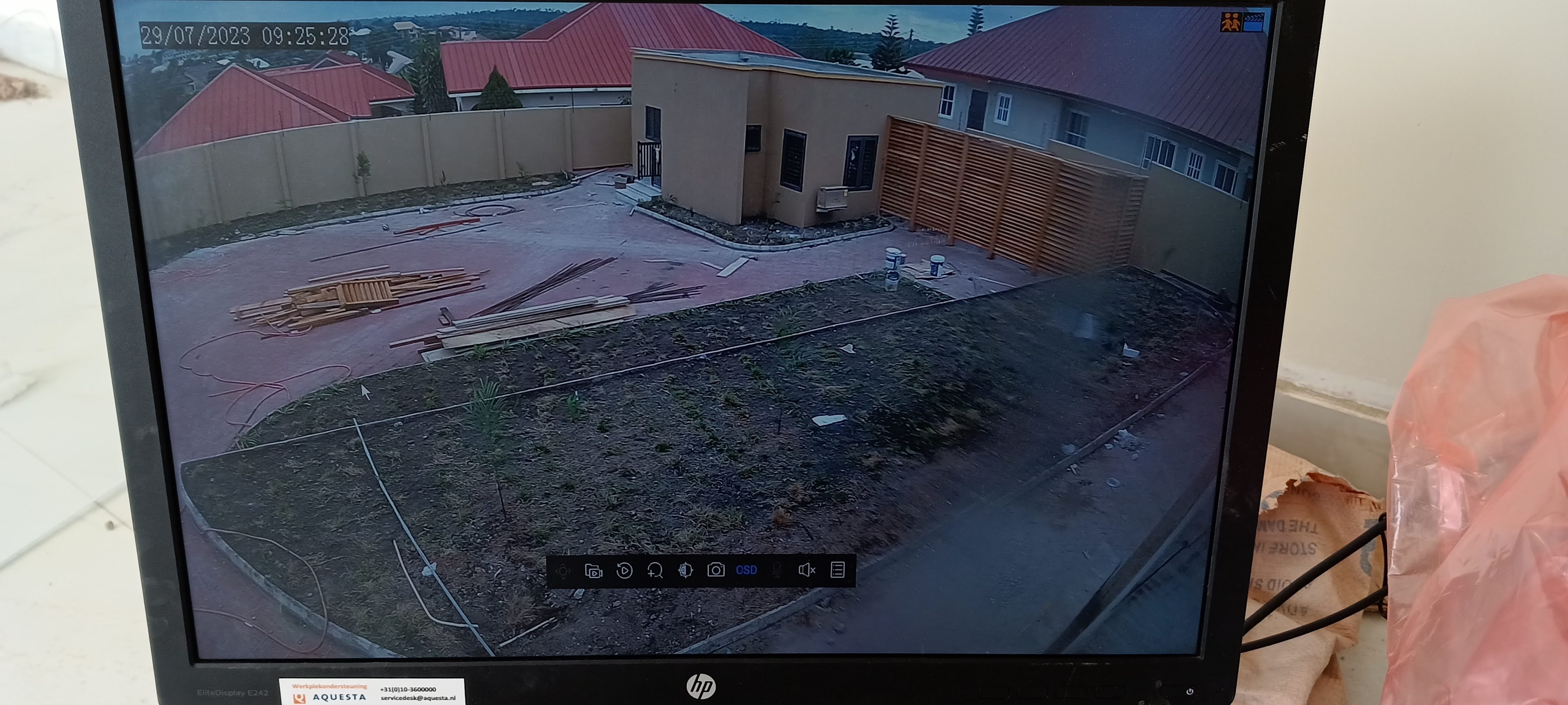 A gated estate viewed on an FBI-installed CCTV monitor