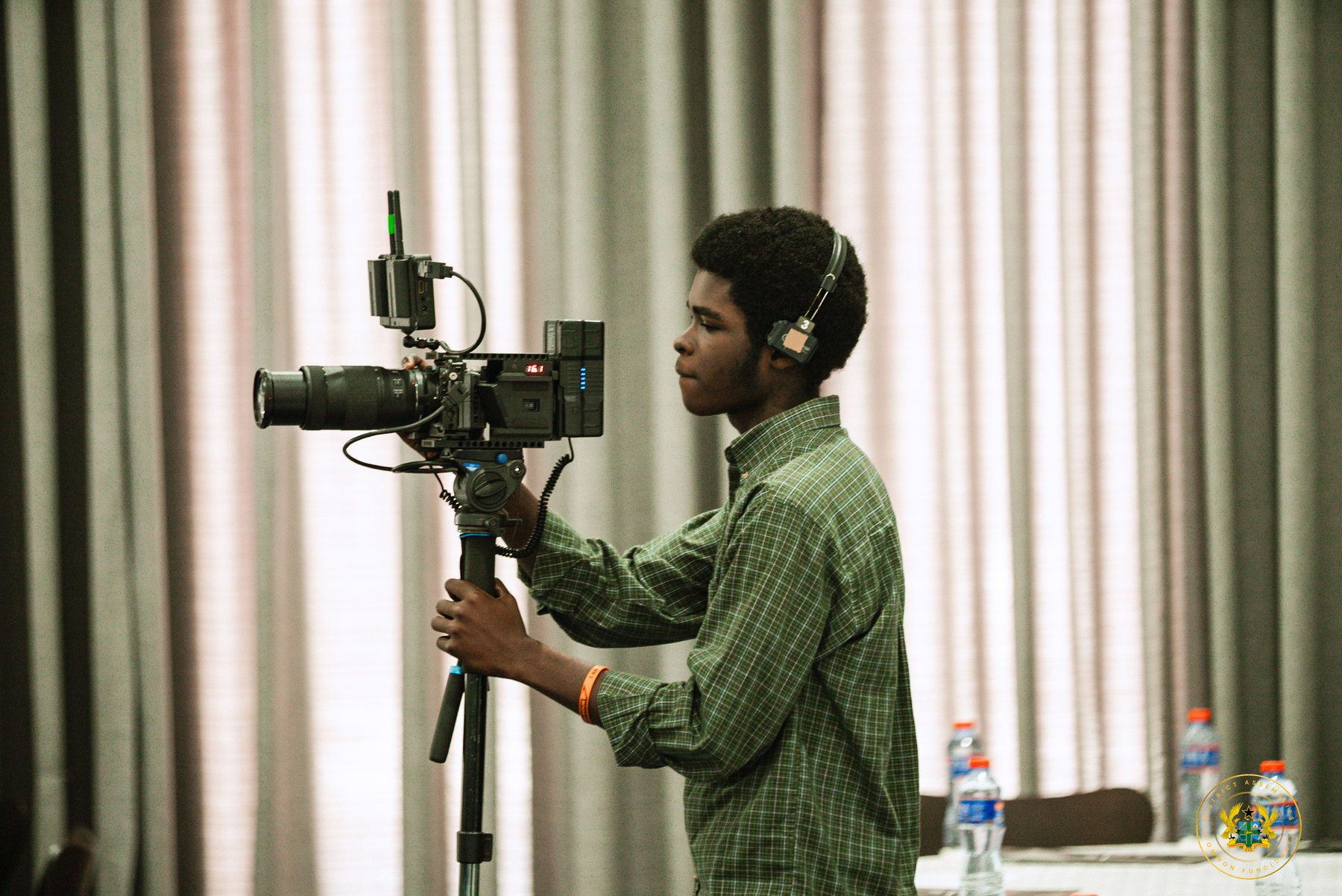 Camera operator filming an event