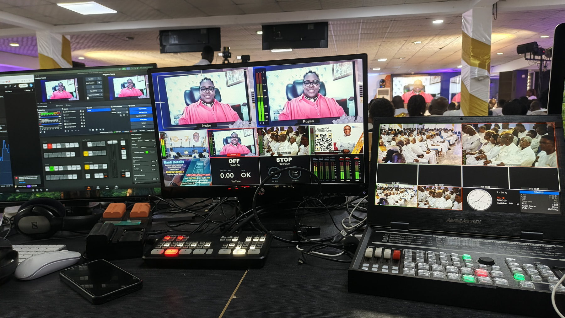 Live broadcast control room with multiple production monitors